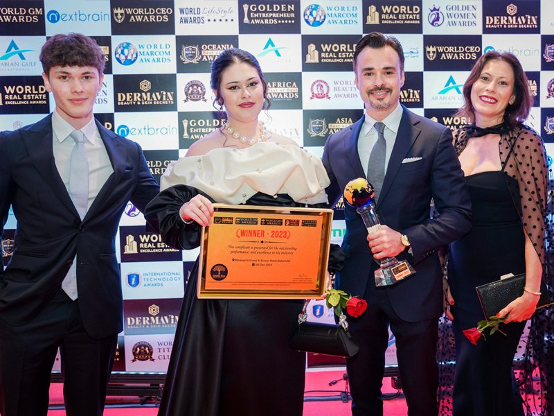 A celebrated restaurant team accepting recognition for culinary innovation